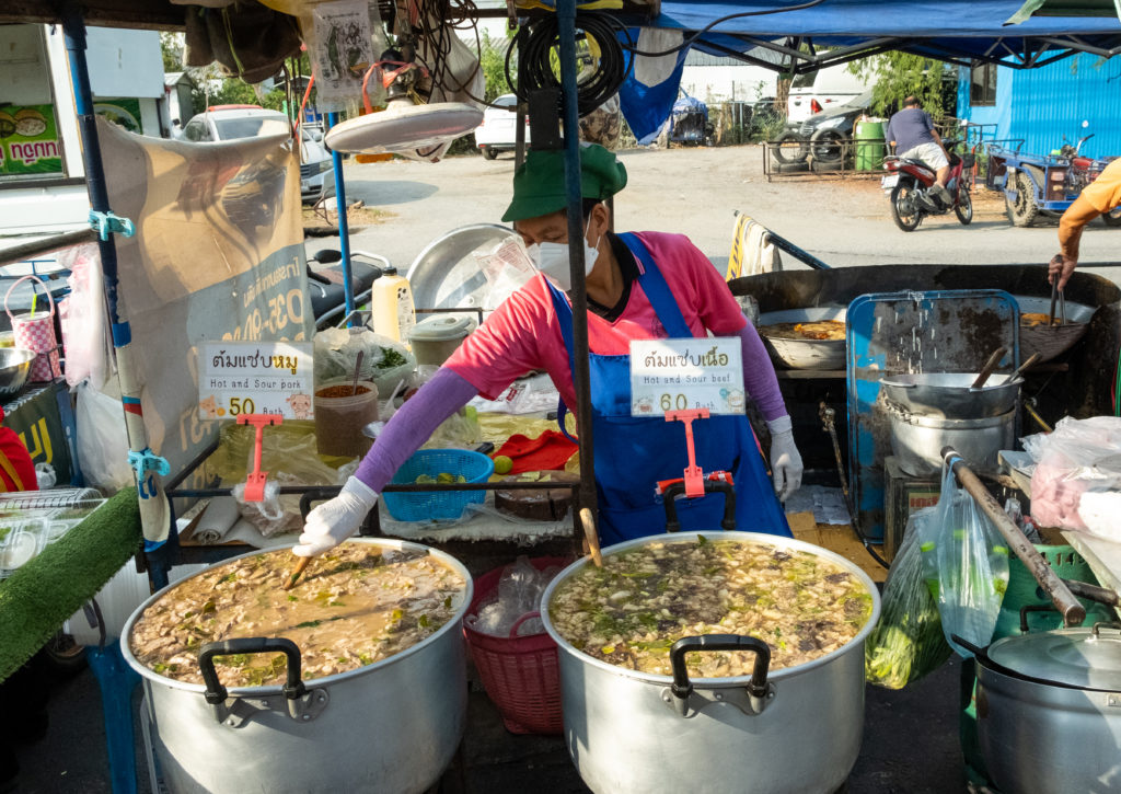 A street food vendor minding curry in Ayutthaya
